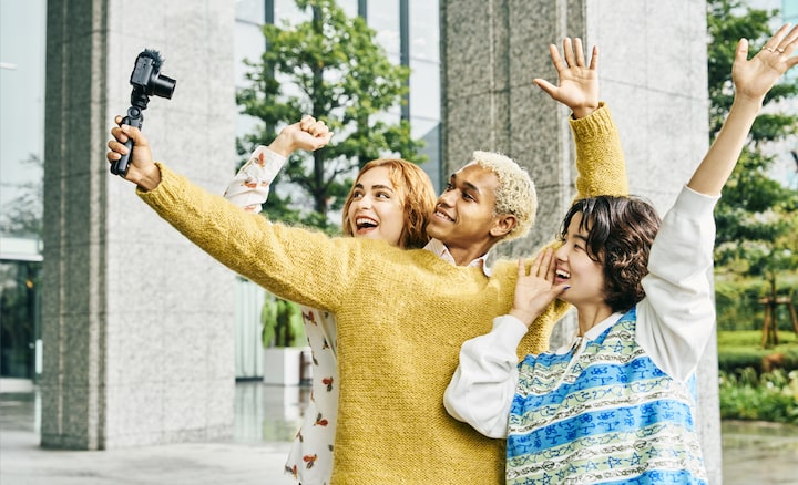Image of three models shooting selfie